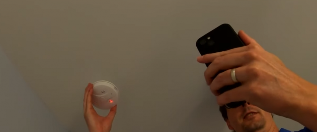 Man checking cameras in room with application